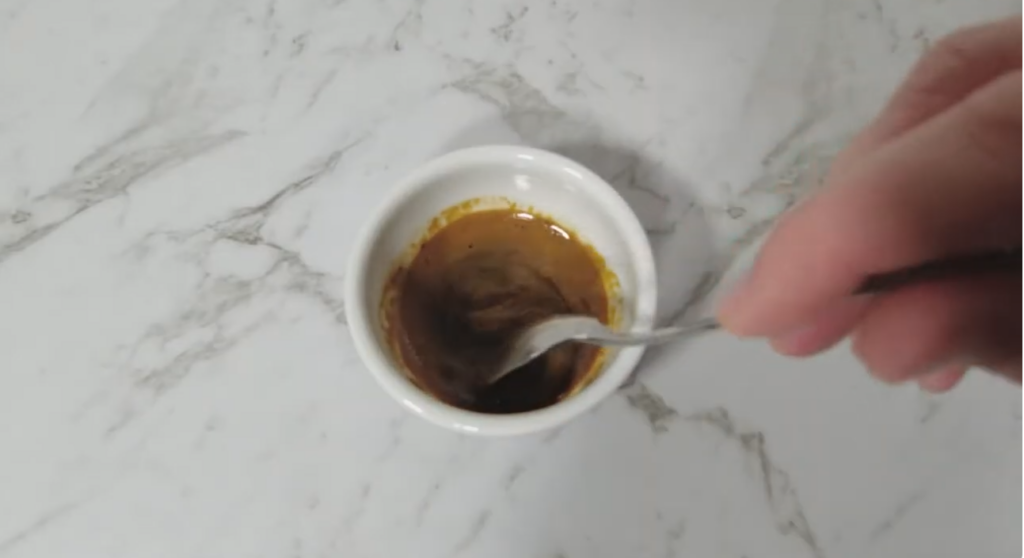 Small bowl with dissolved instant coffee.