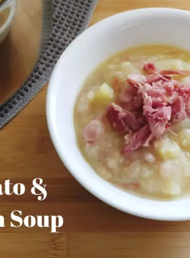Bowl of Potato and Bacon soup with a soup spoon to the right and a pot of Potato and Bacon soup on the back left side.
