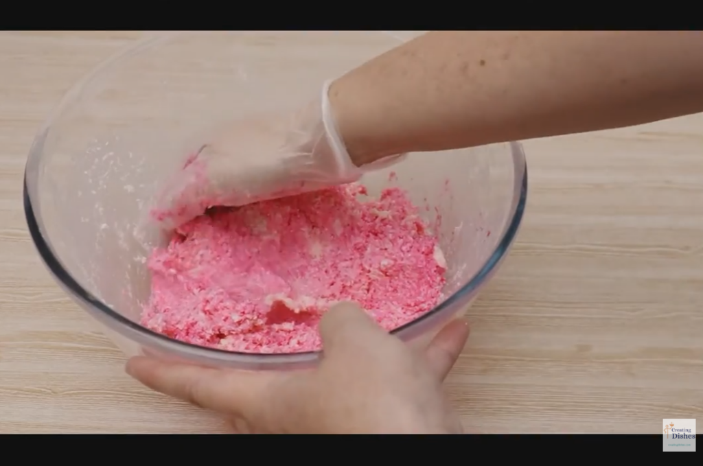 Making pink coconut ice.