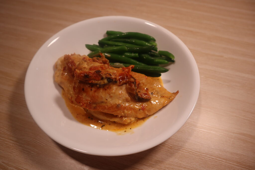 Marry Me Chicken with sundried tomato cream sauce and green beans