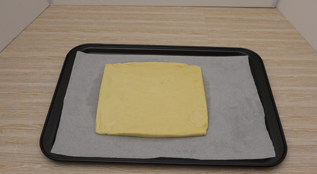 Lined baking tray with shortbread ready to go in the oven. 