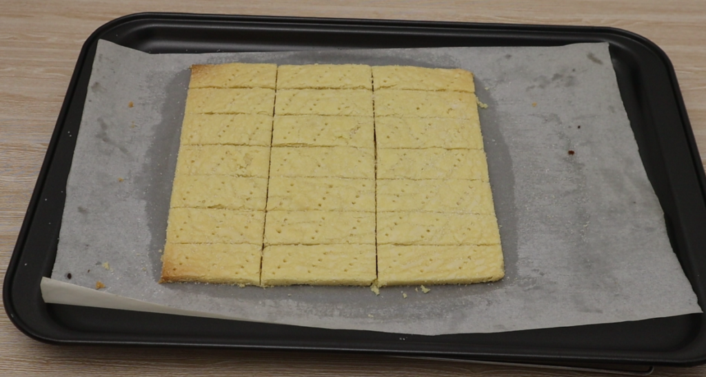 Cooked shortbread on a baking tray