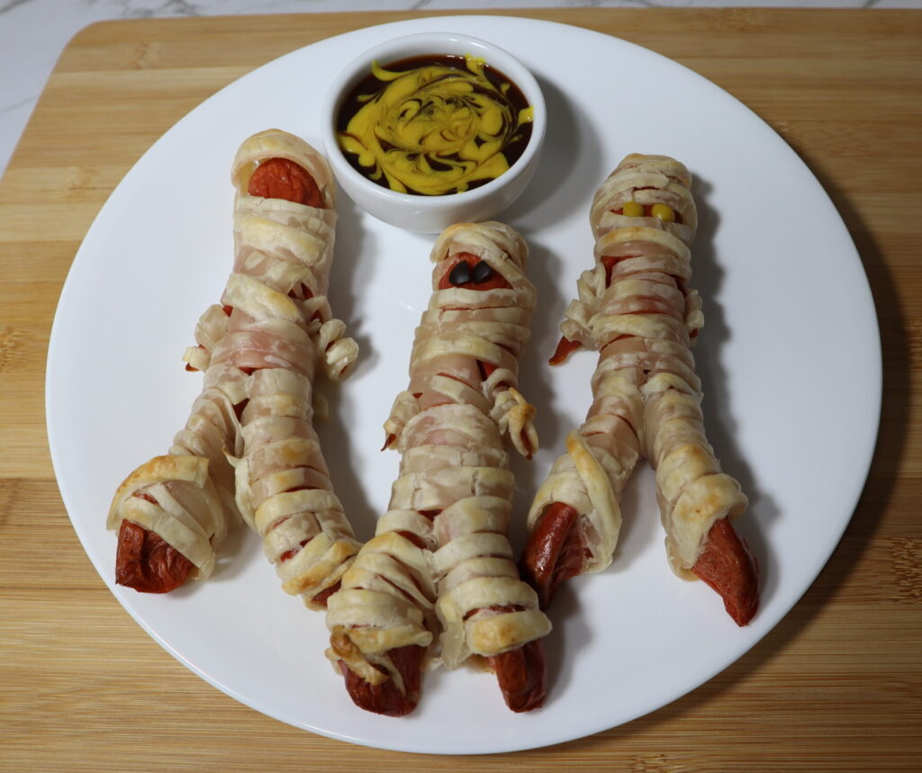 Halloween Mummy Dogs: Hot Dog sausages wrapped in puff pastry