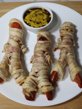 Halloween Mummy Dogs: Hot Dog sausages wrapped in puff pastry