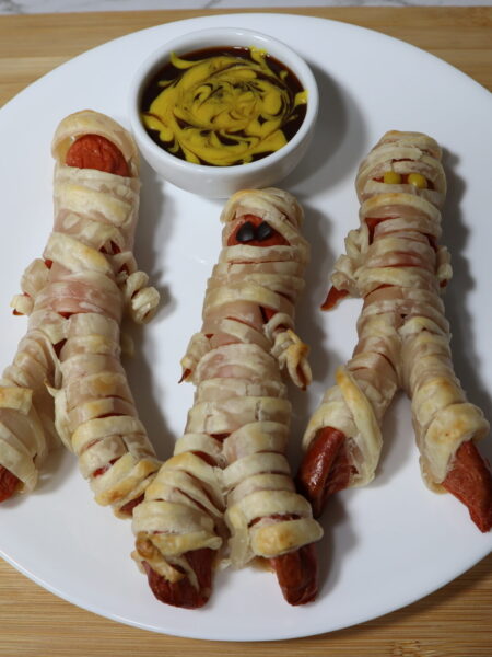 Halloween Mummy Dogs: Hot Dog sausages wrapped in puff pastry