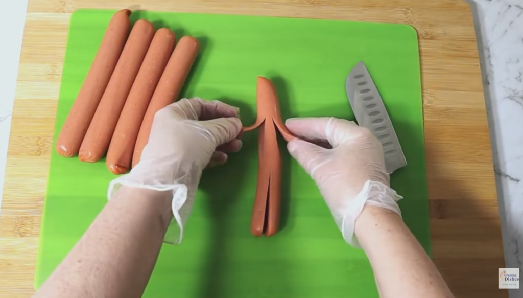 Halloween Mummy Dogs: cutting arms and legs.