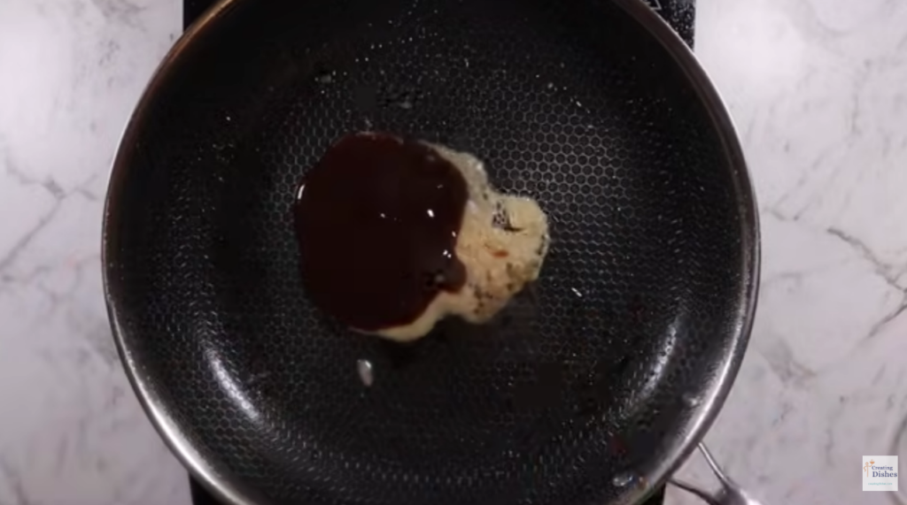 Frying pan with aromatics cooking  