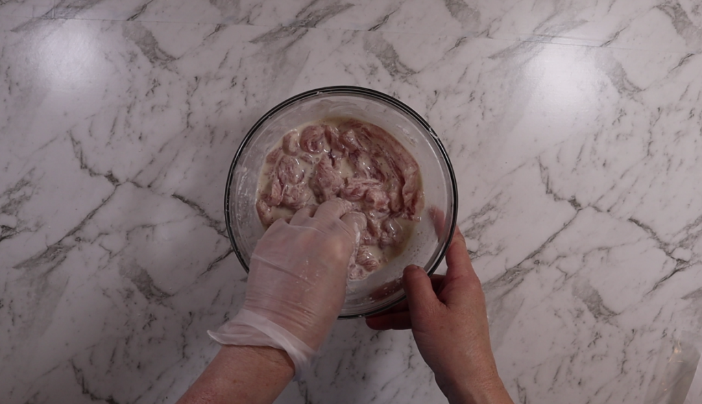 Prepared pork in batter, ready for cooking. 